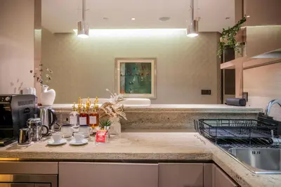 a kitchen with a sink and a counter top at Lavish Studio at Creek Heights Residences - Boutique Concept by UDH in Dubai