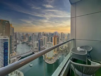 a view of a city from a balcony of a building at Waterfront 1BR - Marina Views - Walk to Beach & Mall in Dubai