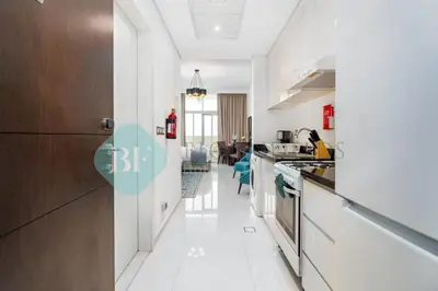 a kitchen with white floors and a long hallway at Bloomfields Stylish Stu in Damac Ghalia in Dubai