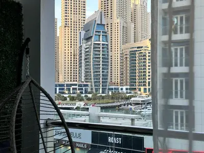 a view of a city skyline from a window at Stylish Studio with Stunning Marina Canal Views near to the Beach in Dubai