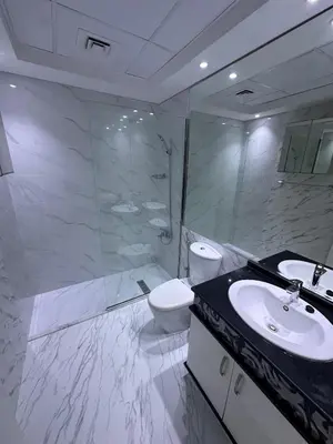 a bathroom with a sink and a toilet and a shower at Great & huge apartment high floor! in Dubai