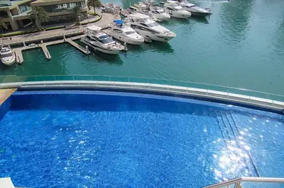 an aerial view of boats in a marina at Frank Porter - Cayan Tower in Dubai