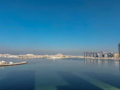 a large body of water with a city in the background at Frank Porter - Beach Vista Tower 2 in Dubai