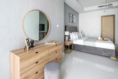 a bedroom with a bed and a mirror at Frank Porter - Paramount Midtown in Dubai