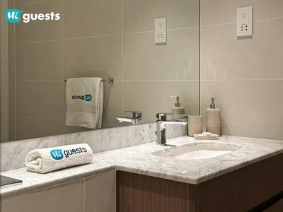 a bathroom counter with a sink and a mirror at HiGuests - Elegant 1BR Retreat with Sea View in La Rive in Dubai