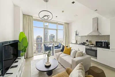 a living room with a couch and a table at Silkhaus Comfy Studio in Liberty House DIFC Heart in Dubai