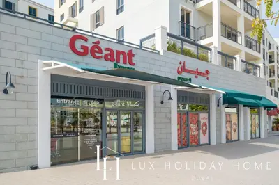 a store front of a building with a sign on it at LUX The La Mer Luxury Burj View Suite 3 in Dubai