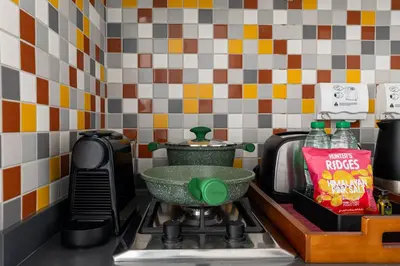 a kitchen counter with a bowl on a stove at Studio Palm Views West, Palm Jumeirah in Dubai