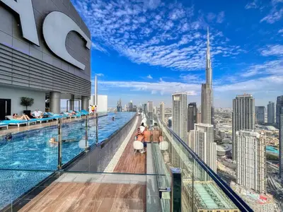 a swimming pool on the top of a building at The Highest Infinity Pool in Downtown Dubai in Dubai