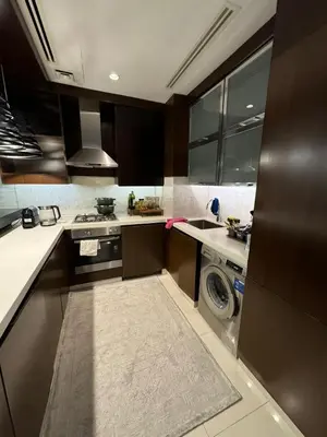 a kitchen with a washer and a washing machine at Bright and Airy 2BR Bay Retreat in Dubai