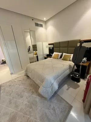 a bedroom with a bed and a desk and a chair at Bright and Airy 2BR Bay Retreat in Dubai