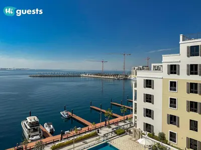 a view of a large body of water with a building at HiGuest - Stylish 1BR Apartment in La Mer in Dubai