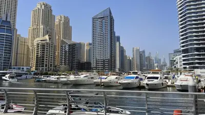 a bunch of boats docked in a harbor with a city at Condor Marina Star Seaview Studio, Dubai Marina in Dubai