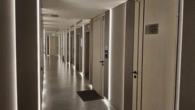 an empty hallway of a building with white walls and floors at Condor Marina Star Seaview Studio, Dubai Marina in Dubai