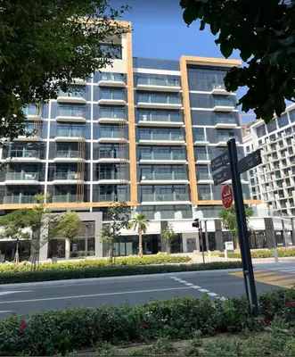a street sign in front of a large building at AMLY holiday home DUBAI in Dubai