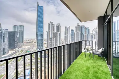 a balcony with a view of a city at Classic BNB - Ahad Large 1BR for 4 in Dubai