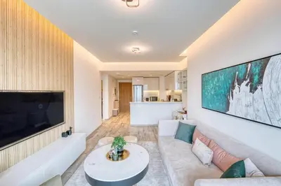 a living room with a large flat screen tv at Classic BNB - Ahad Large 1BR for 4 in Dubai
