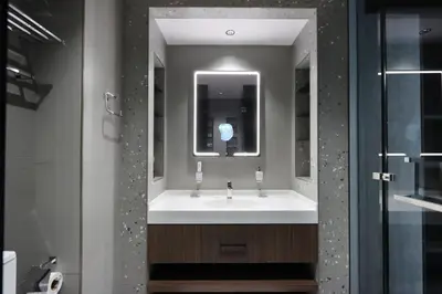 a bathroom with a sink and a mirror at Livbnb-Embrace Luxury and Comfort in Prime 1BR,JLT in Dubai