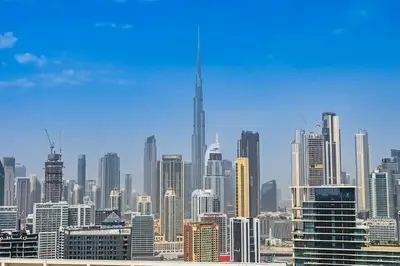 a view of a large city skyline with skyscrapers at Stunning 1Bdr Luxury with Burj Khalifa View in Dubai