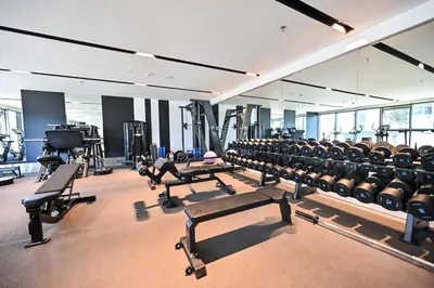 a gym filled with lots of exercise equipment at Stunning 1Bdr Luxury with Burj Khalifa View in Dubai