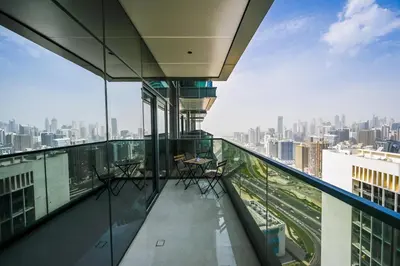 a balcony with chairs and a view of a city at Stunning 1Bdr Luxury with Burj Khalifa View in Dubai