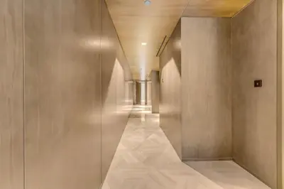 a hallway of a building with a long corridor at luxury penthouses see view at five in Dubai