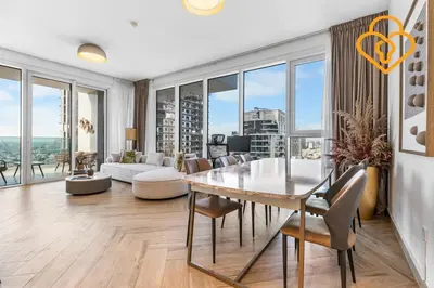 a living room with a table and chairs and a couch at Keysplease 2BR Minutes to WTC and Downtown, Al Wasl Zaabeel Park in Dubai