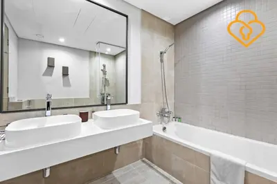 a bathroom with two sinks and a mirror and a tub at Keysplease 2BR Minutes to WTC and Downtown, Al Wasl Zaabeel Park in Dubai