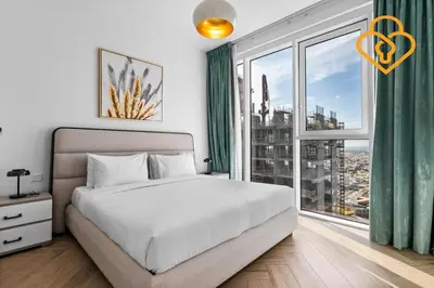 a bedroom with a bed and a large window at Keysplease 2BR Minutes to WTC and Downtown, Al Wasl Zaabeel Park in Dubai