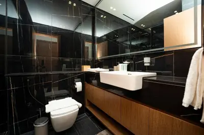 a bathroom with a toilet and a sink at AWS Holiday Homes - Perfect Dubai Stay! in Dubai