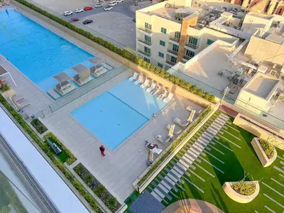 an overhead view of a swimming pool in a building at AWS Holiday Homes - Perfect Dubai Stay! in Dubai