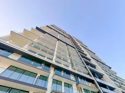 a tall apartment building with a lot of windows at AWS Holiday Homes - Perfect Dubai Stay! in Dubai