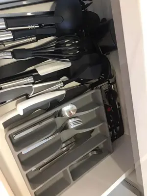a drawer filled with silver utensils at Pet Free Studio Apartment Close Downtown Fast Wi-fi in Dubai