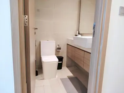 a bathroom with a toilet and a sink at Pet Free Studio Apartment Close Downtown Fast Wi-fi in Dubai