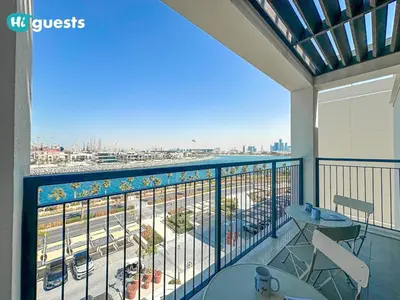 a balcony with a view of a city at HiGuest - Coastal Luxury 2BR in La Mer Beachside Bliss in Dubai