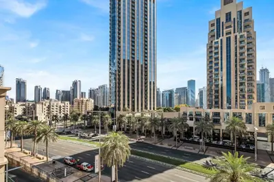 a view of a city with palm trees and buildings at GuestReady - Luxe 1BD Near Dubai Mall | 29 Blvd in Dubai