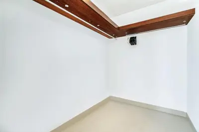 a room with white walls and a wooden ceiling at GuestReady - Luxe 1BD Near Dubai Mall | 29 Blvd in Dubai