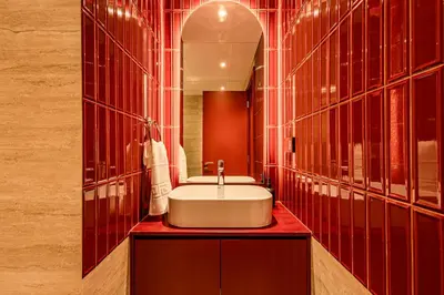 a bathroom with a sink and a mirror at Stylish Luxury in the Heart of DIFC in Dubai