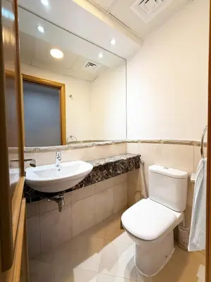 a bathroom with a toilet and a sink at One Bedroom Apt in Dubai Marina near beach Z1911 in Dubai
