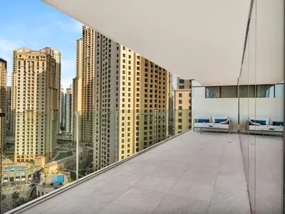 a balcony with a view of a city at 1BR Suite FIVE LUXE - Pool & Beach view - Private Hot Tub - Ventura Stays in Dubai