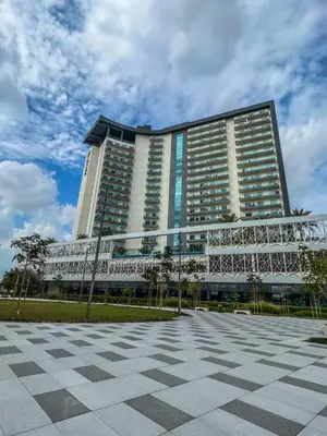 a large building with a checkered floor in front of it at Fully Furnished Elegant Studio Apartment Close by Dubai Science Park, Dubai Miracle Garden, Butterfly Garden and Dubai Hills Mall in Dubai