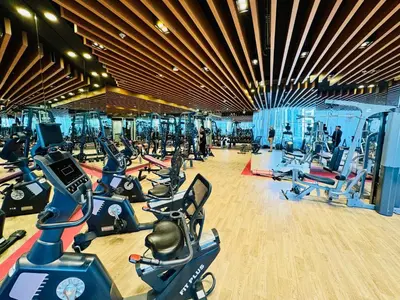 a gym with a bunch of exercise bikes in it at Luxury Studio Bayz By Danube Business Bay Marasi Drive Dubai in Dubai