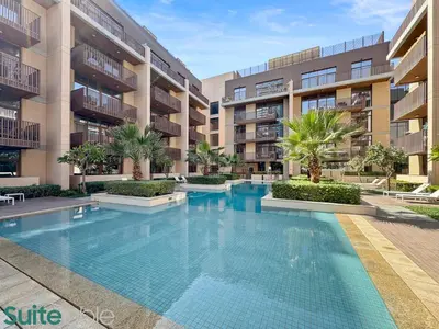 an empty swimming pool in a apartment building at Serene 1 Bedroom apartment in Belgravia - JVC in Dubai