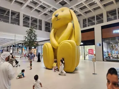 a large yellow balloon in the middle of a mall at Park Point C-1 bedroom for monthly stay-1004 in Dubai