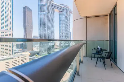 a balcony with a view of a city at Burj Vista Tower 2, Downtown - Upgarded 2 bedroom in Dubai