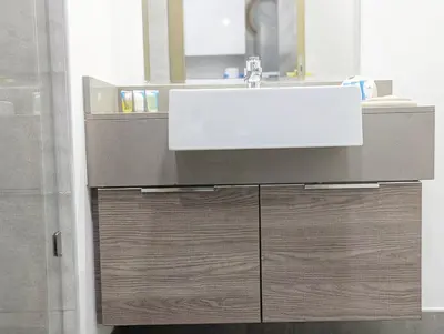 a bathroom with a sink and a mirror at Fully Furnished Cozy Studio at JVC Dubai, Short Drive to Dubai Marina, JBR, Downtown Dubai in Dubai