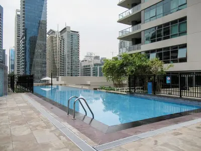 a swimming pool in a city with tall buildings at GuestReady - Glamorous stay in Dubai Marina in Dubai