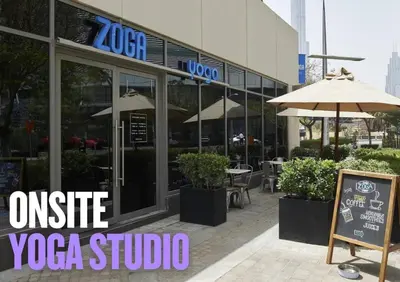 a restaurant with an outside yoga studio with an umbrella at Luxury Living Brand New 1 Bed Downtown Dubai Southridge in Dubai