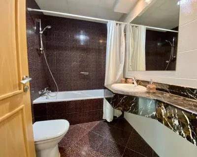 a bathroom with a toilet and a sink and a tub at ONE Bedroom with Sea view in Dubai Marina - Z1106 in Dubai