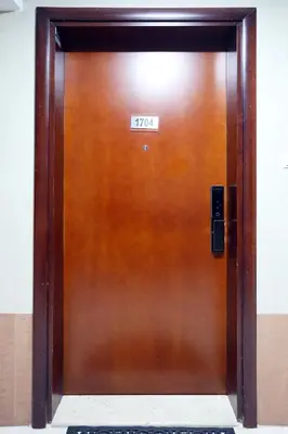a wooden elevator door with a sign on it at LUXURY 1BED MARINA VIEW JBR BEACH POoL PARKING in Dubai
